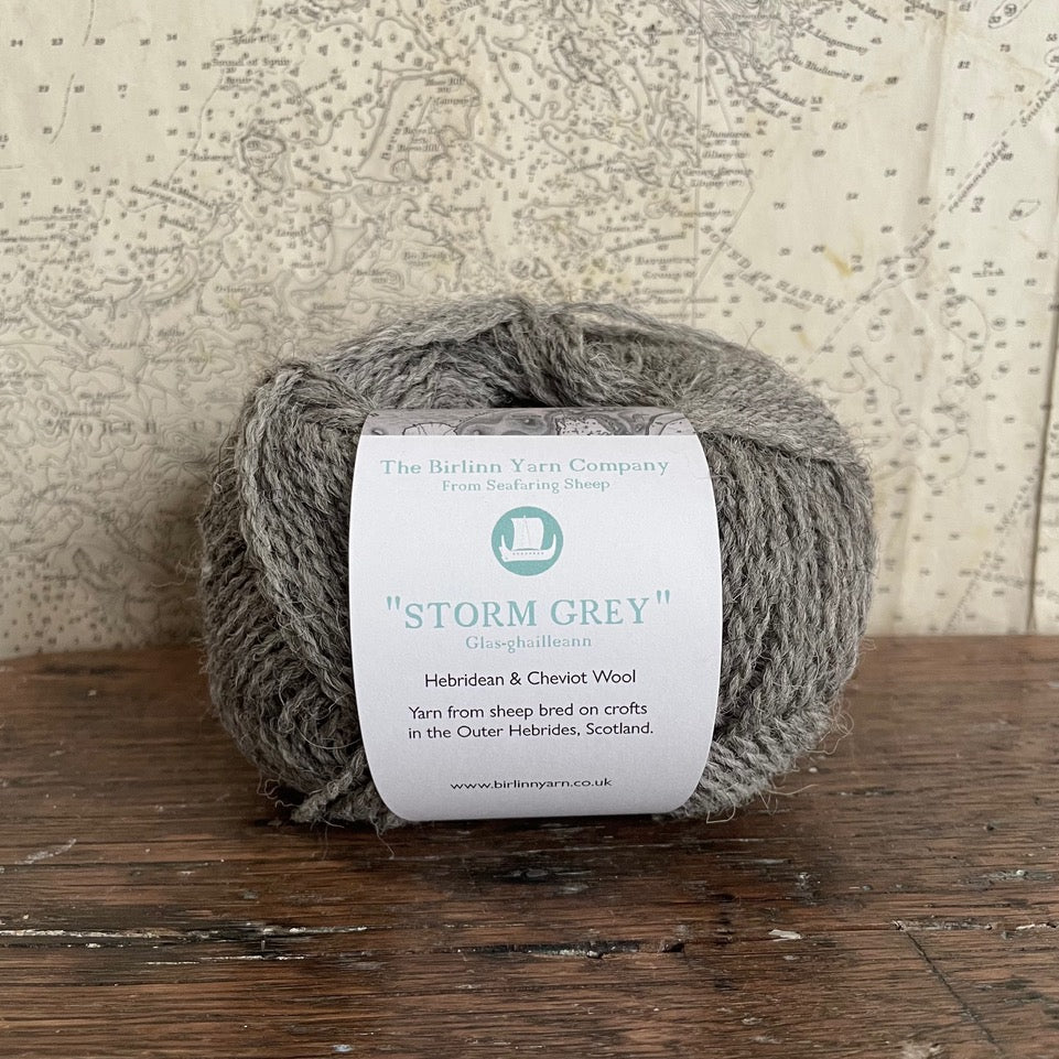 Ball of 4 ply finger weight un-dyed natural yarn from a blend of Hebridean and Cheviot sheep on Berneray. Scottish Textiles Showcase.