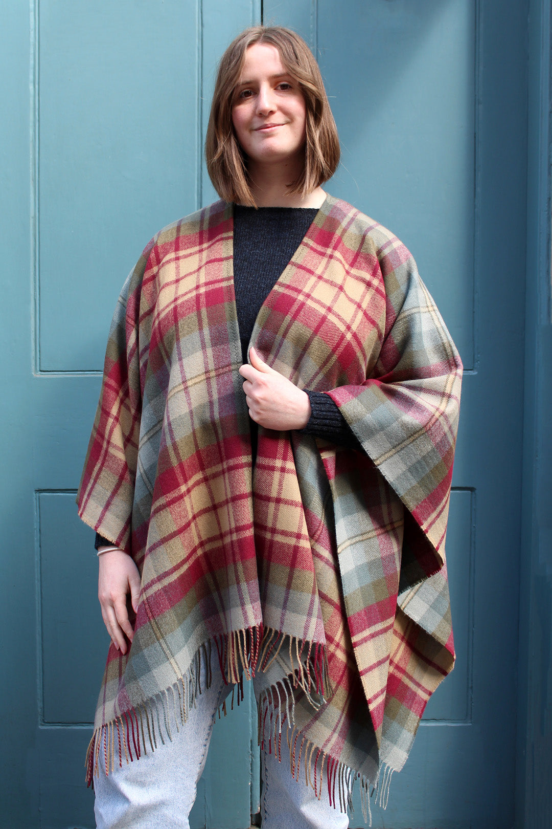 The Auld Scotland tartan serape features earthy shades of green, burgundy, camel and dusky blue.