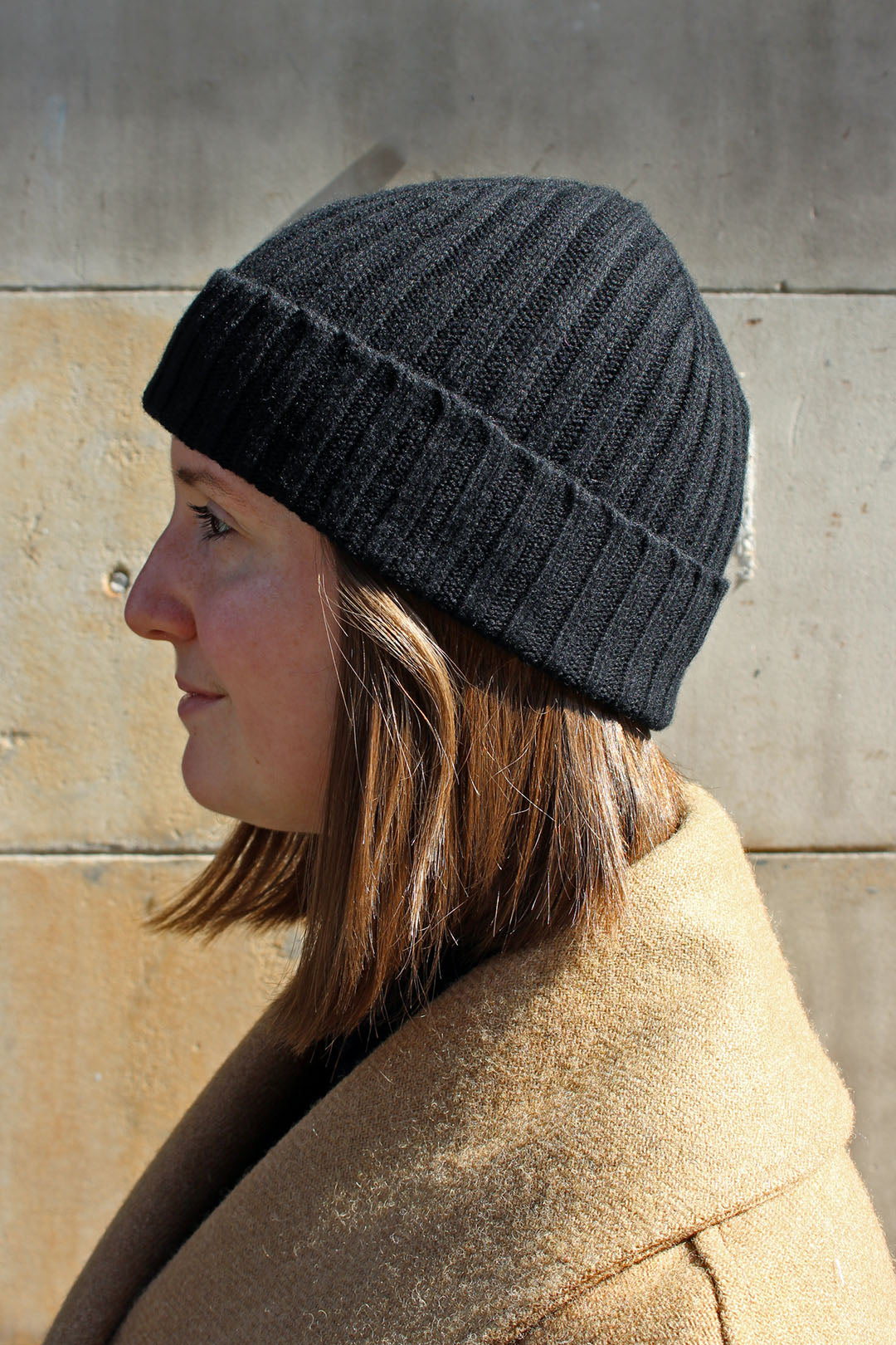 Knitted cairn hat in black, knitted in scotland