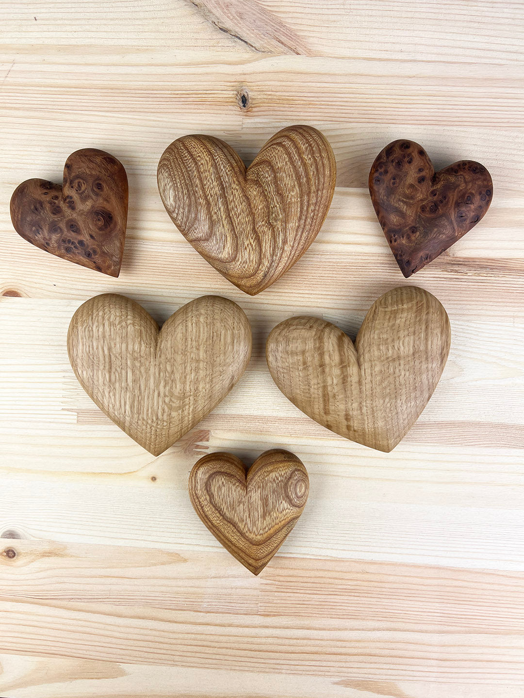 Hand carved wooden hearts in oak and elm.