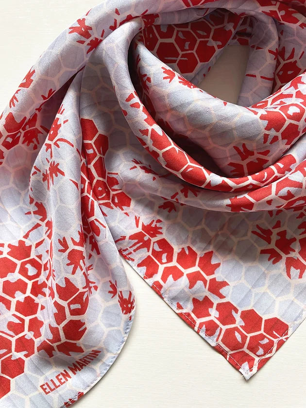 The Kyoto large silk scarf has been digitally printed with a beautiful repeat pattern in red and pale blue.