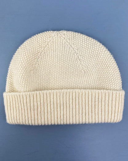 Cuillin hat knitted in natural white undyed British wool. Scottish Textiles Showcase.