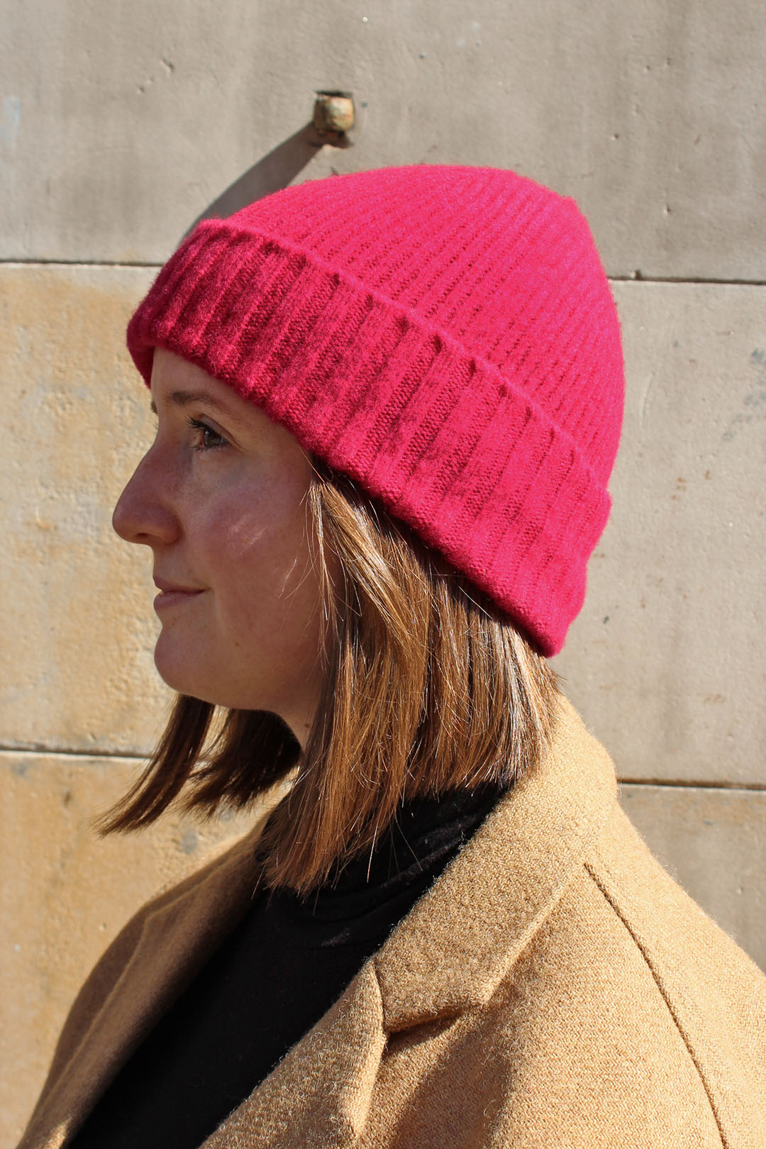 Knitted wool rona hat in fuchsia, knitted in scotland
