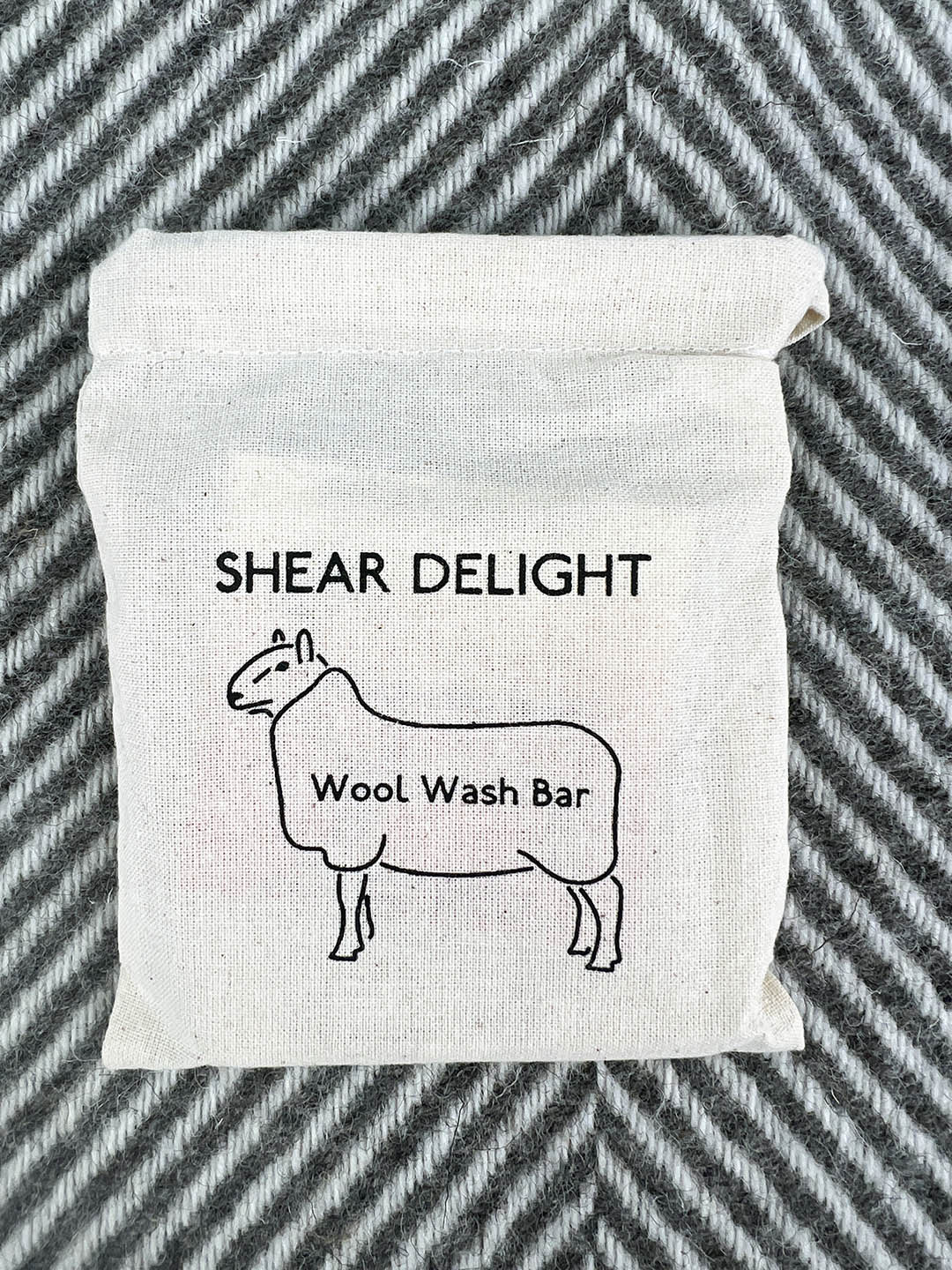 Wool wash bar with pouch bag and instructions for use.