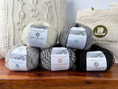 Ball of 4 ply finger weight cream white Bog Cotton yarn from Cheviot sheep in North Uist. Scottish Textiles Showcase.