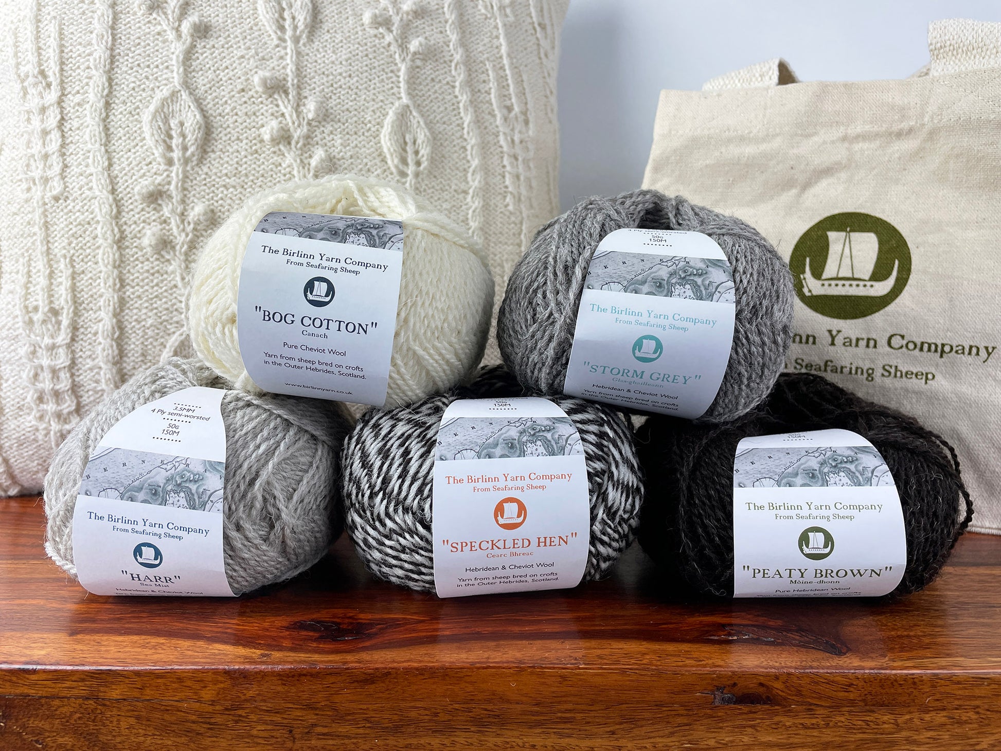 Ball of 4 ply finger weight light grey sea mist colour yarn from Cheviot sheep in North Uist and Hebridean sheep on Berneray. Scottish Textiles Showcase.
