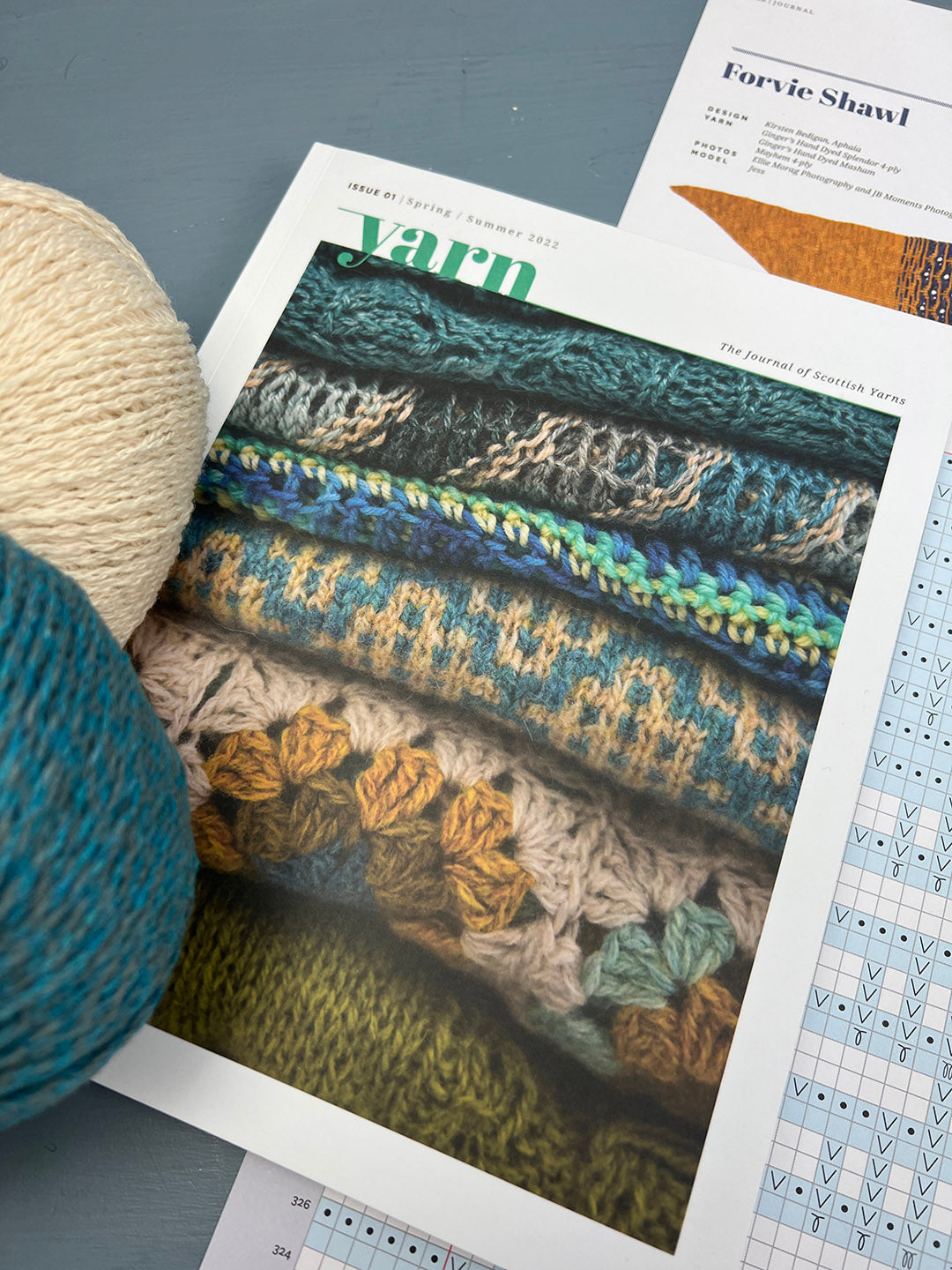The Journal of Scottish Yarn with knitting patterns insert and two balls of wool.