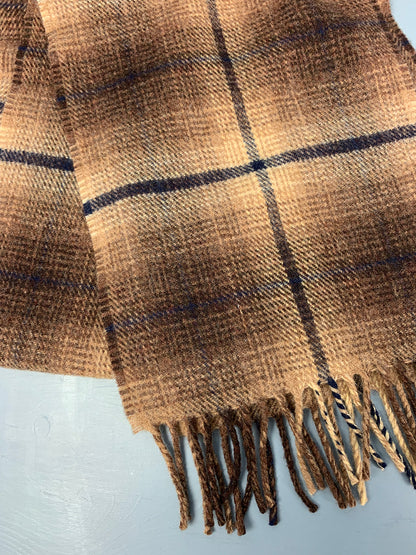Scottish scarf woven in earthy brown hues with a dark blue line