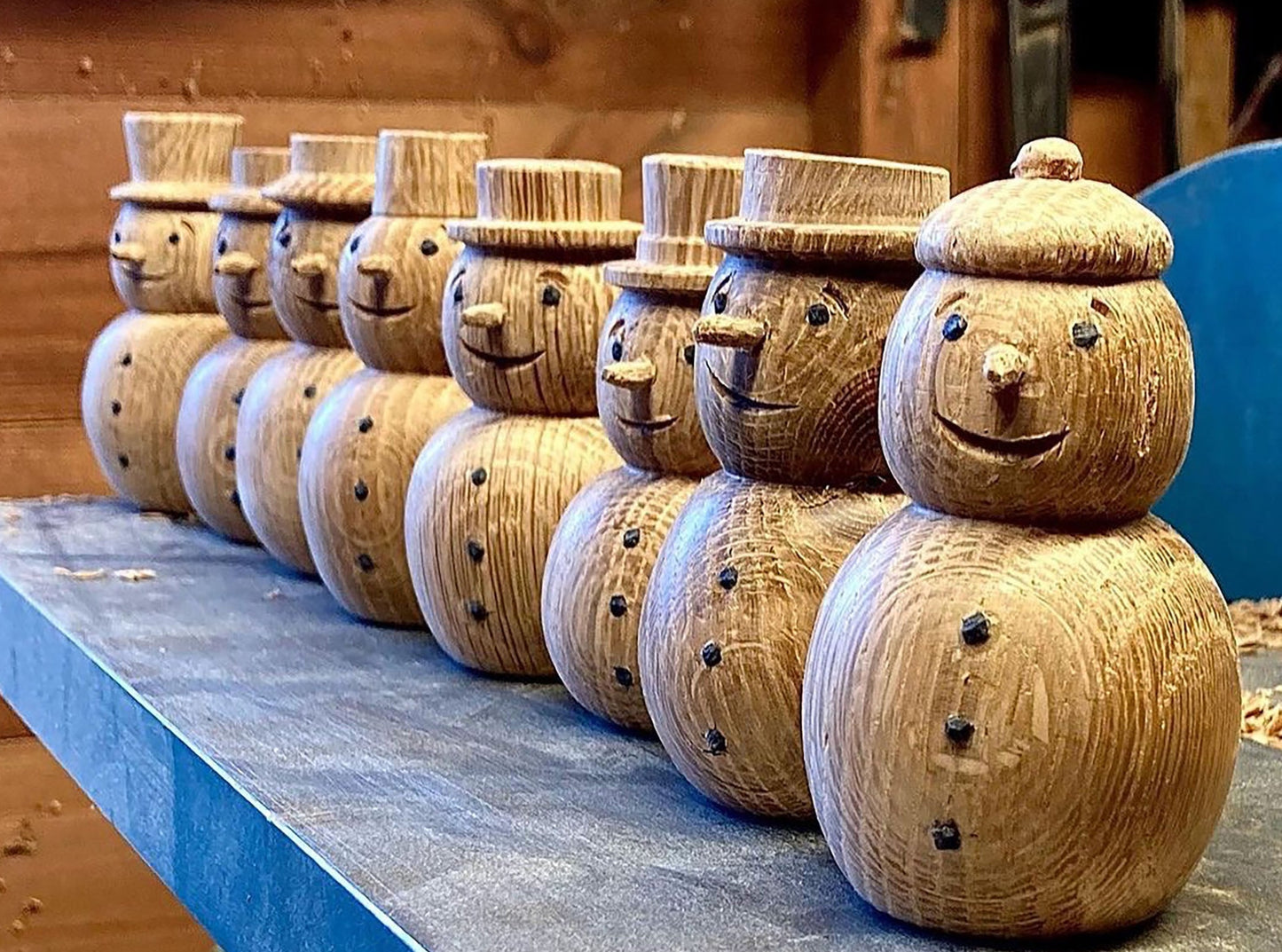 Hand carved wooden snowmen made from scottish Oak. Scottish Textiles Showcase